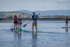 20-6-Paddle-boarding-group-with-Howgills-in-background