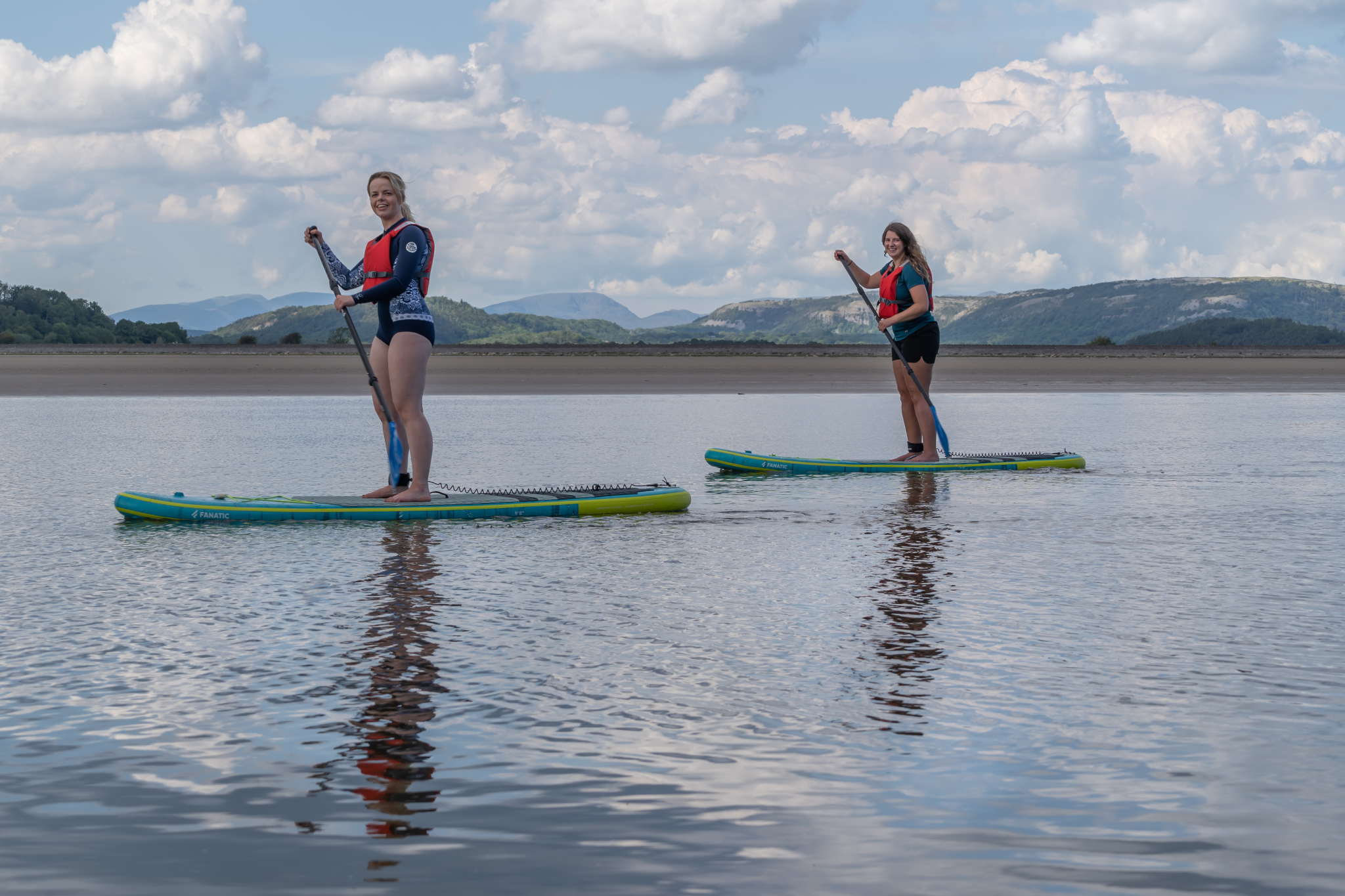 20 – 6 Two young women paddle boarding